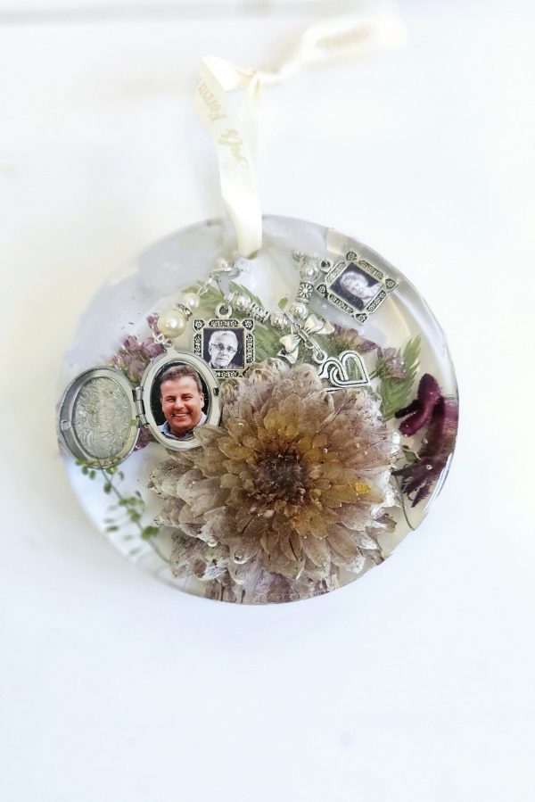 preserved wedding flowers in a resin hanging round disk ornament