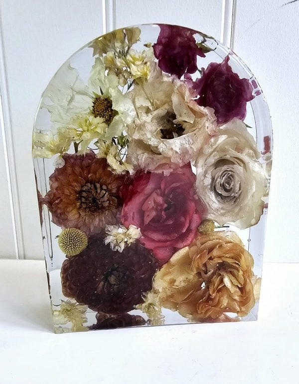 wedding flowers preserved in a crystal clear resin arch