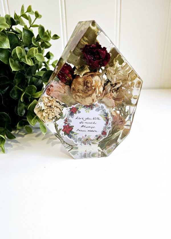 gem shape clear resin ornament with funeral flowers preserved within it
