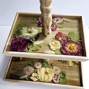 two tier rustic wooden display stand filled with crystal clear resin and wedding flowers preserved, ready to display. handcrafted in the uk